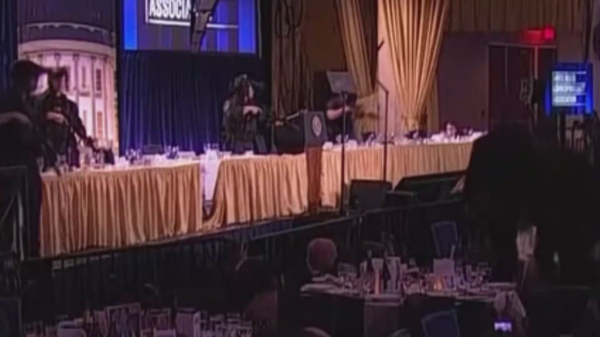 Guests take cover after a loud, unidentified noise, in Washington, D.C. (left) Law enforcement personnel detain a person of interest. (right)(Reuters)